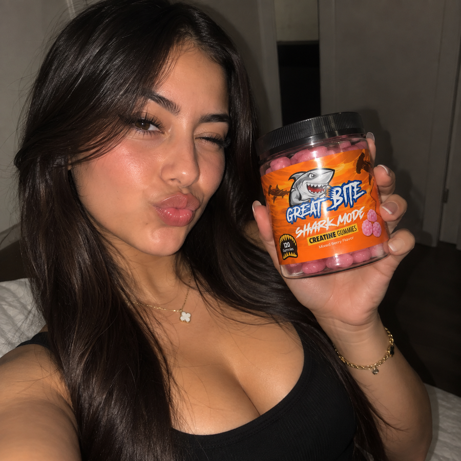 Woman holding Shark Mode creatine gummies